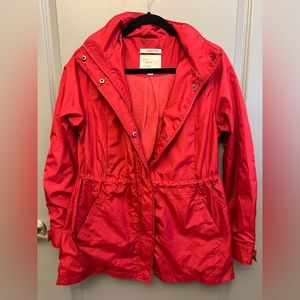 NWOT Bright red lightweight rain coat. Size M